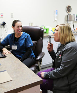 Therapist woring with a patient using Respiratory Therapy.